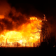 Homes burn at night as a wildfire rips through a development near Rock Creek Village near Broomfield, Colorado.